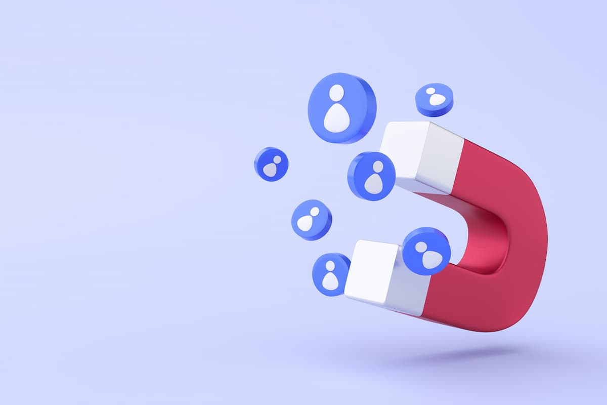 Desenho de ímã vermelho simulando a atração de leads no marketing.