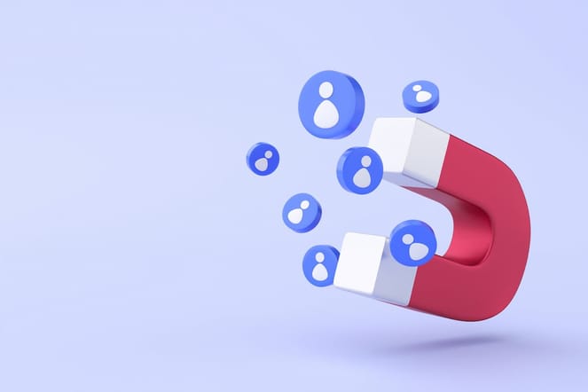 Desenho de ímã vermelho simulando a atração de leads no marketing.